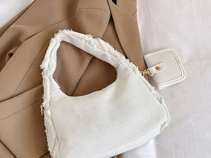 sac a main pose sur affaire style efilochee et brodee avec petite sacoche de derriere 