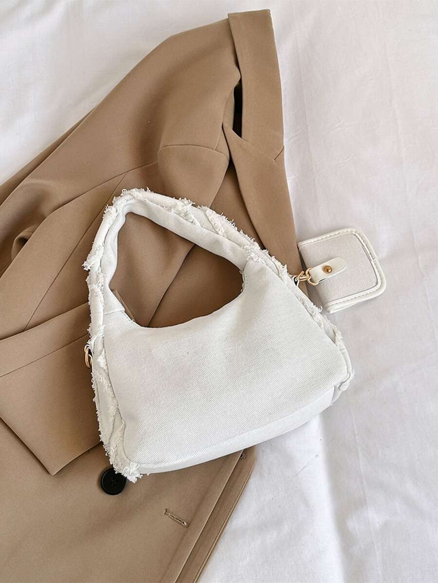 sac a main pose sur affaire style efilochee et brodee avec petite sacoche de derriere 