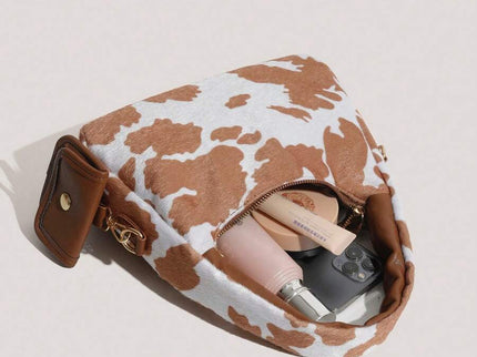 sac a main style tache marron et blanc style animale avec petite sacoche  avec affaire dans le sac