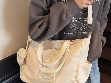 sac cabas en cuir beige pour femme detail sangle et grande sangle depuis devant deux sangle 