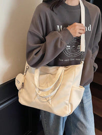 sac cabas en cuir beige pour femme detail sangle et grande sangle depuis devant deux sangle 