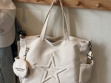 sac cabas en cuir beige pour femme detail sangle sur porte habit